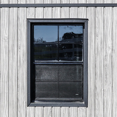 24x36'' black window on the back of a shed