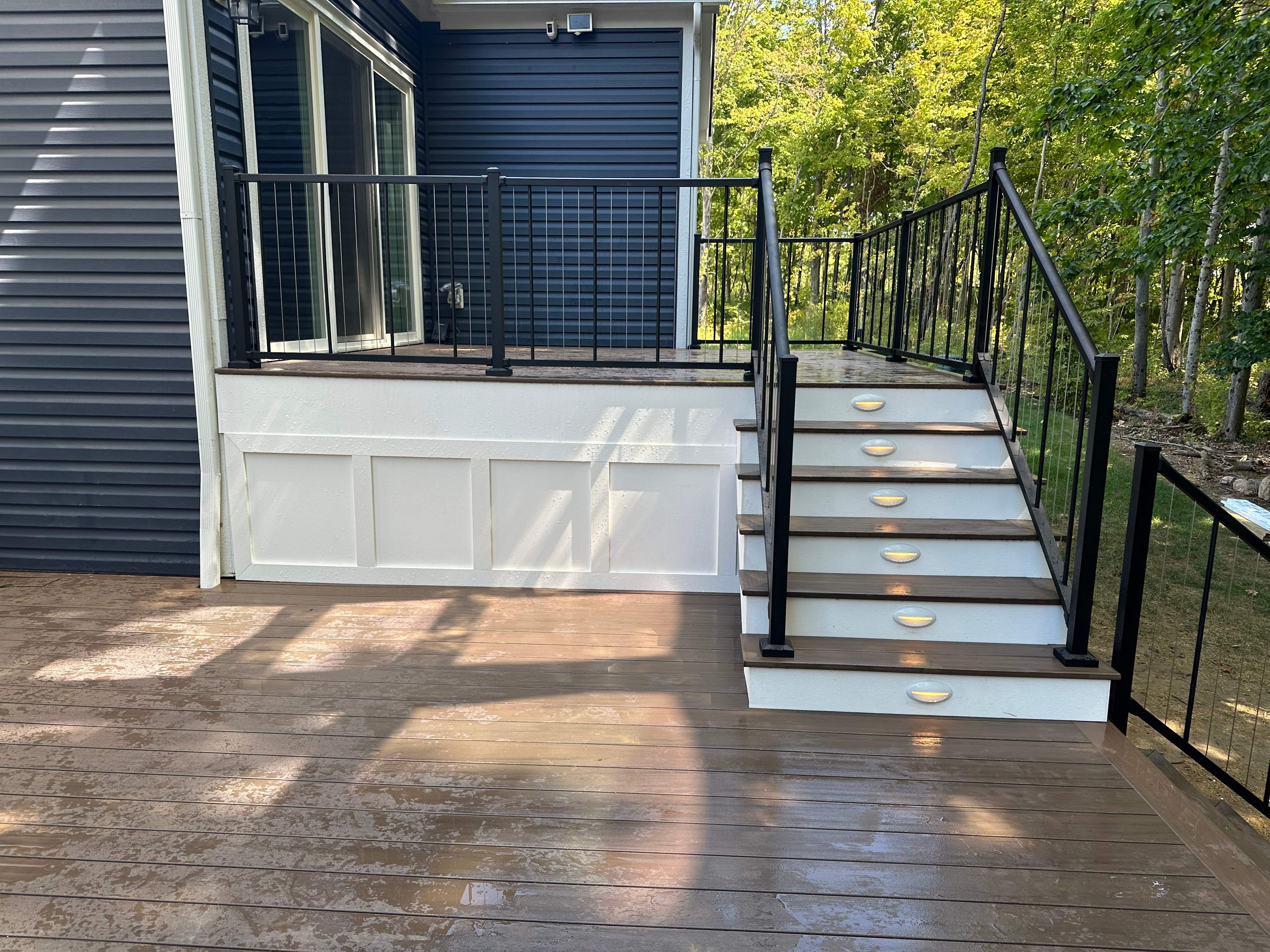PVC apron and vertical cable railing on a deck project by ELC.