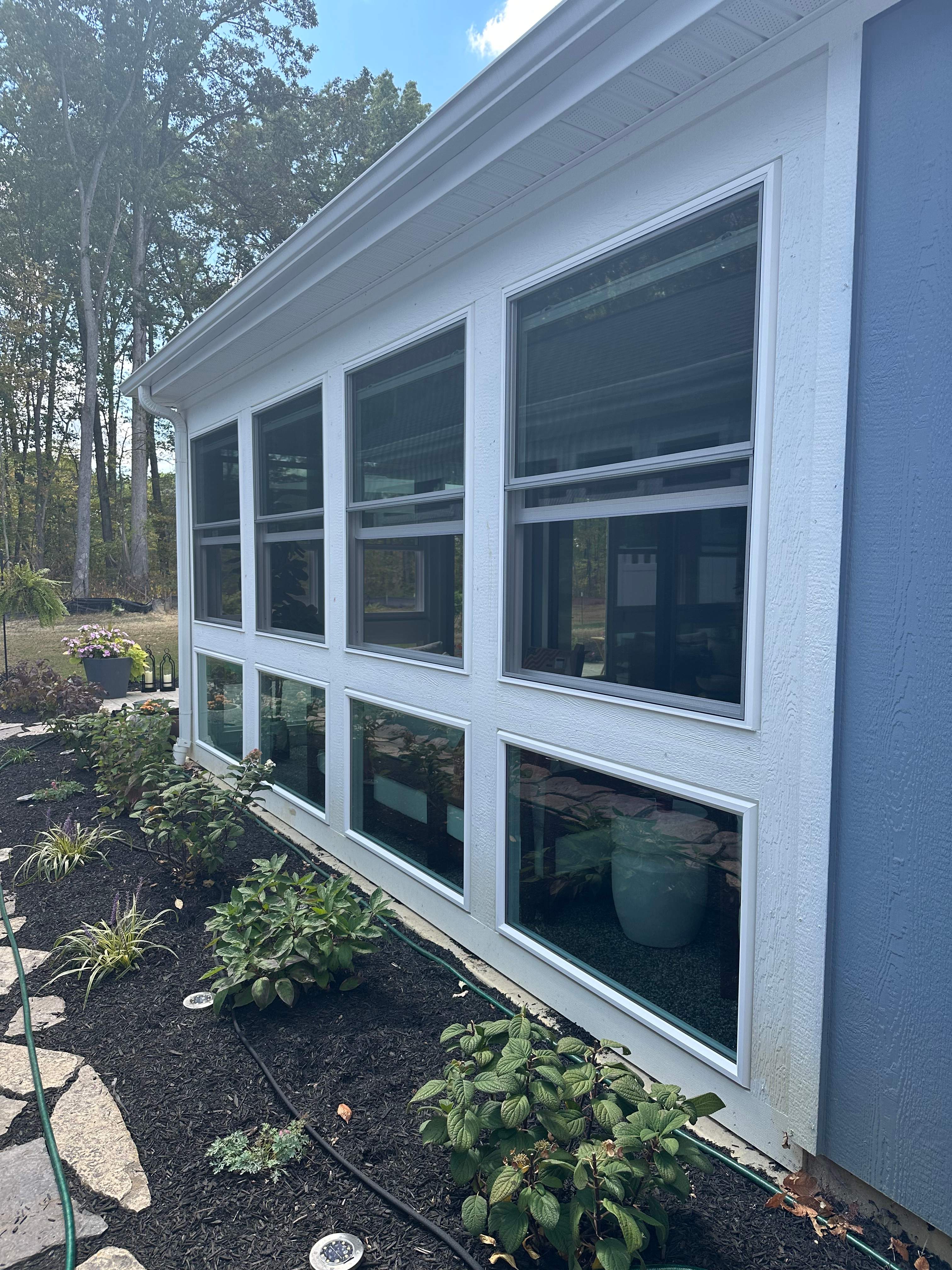 Windows on a glass knee wall system.