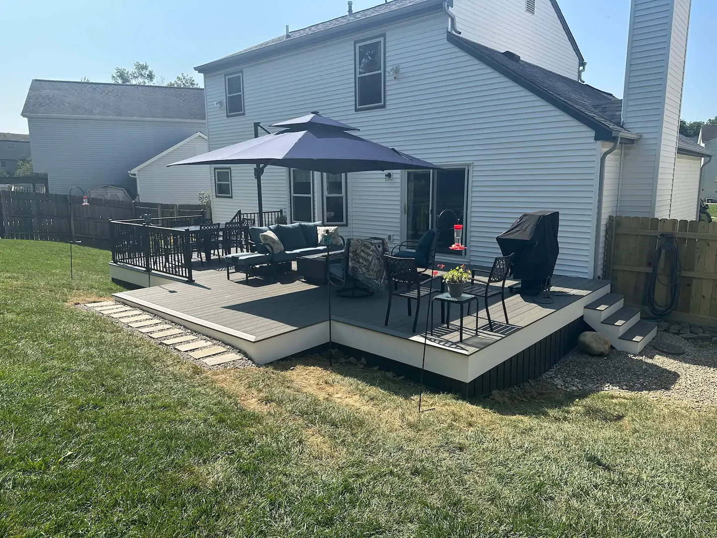 A white deck with Westbury handrails and TimberTech deck materials.