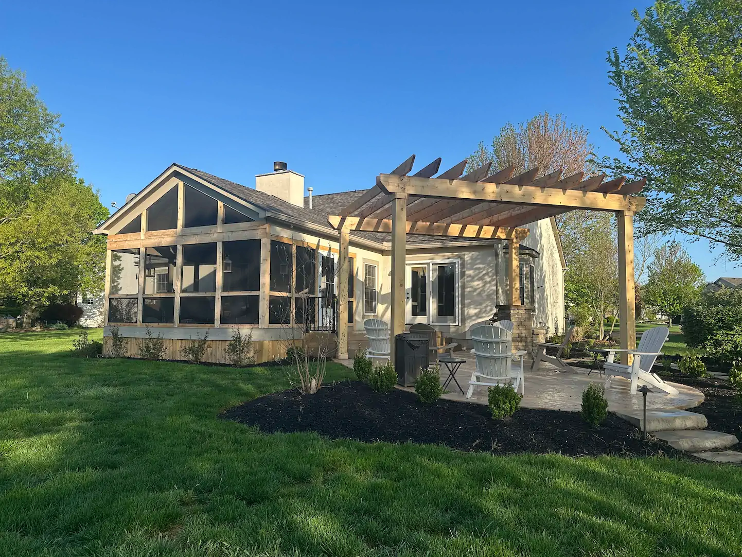 A custom trellis and deck behind a Galena home.