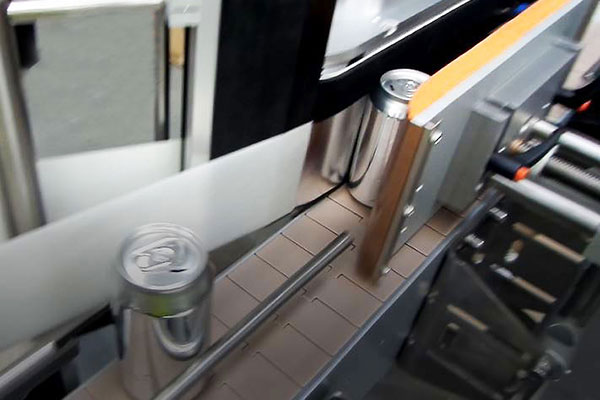 Tronics labeller applicator for aluminium cans