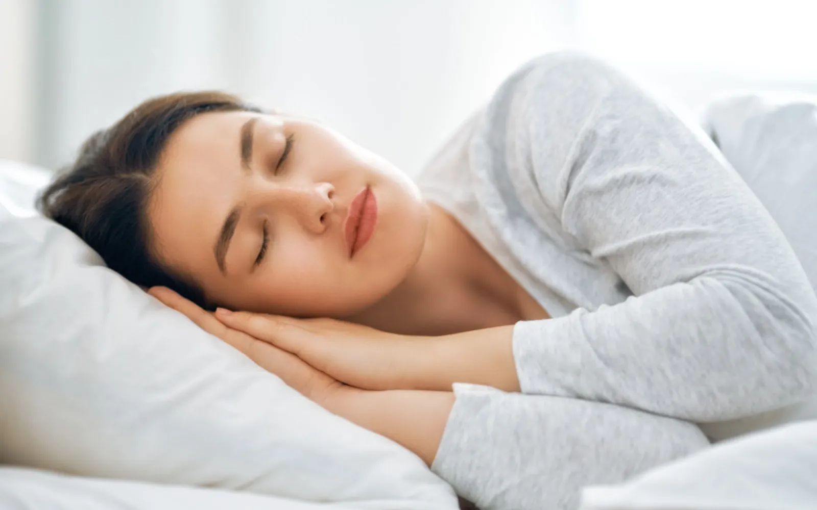 Woman sleeping peacefully after sleep apnea treatment in Missoula, MT