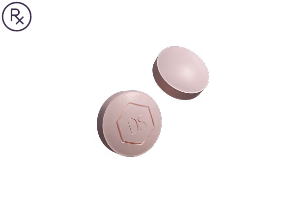 Two round pink tablets, one with the imprint 'DS' inside a pentagon shape, on a black background with a purple Rx symbol.