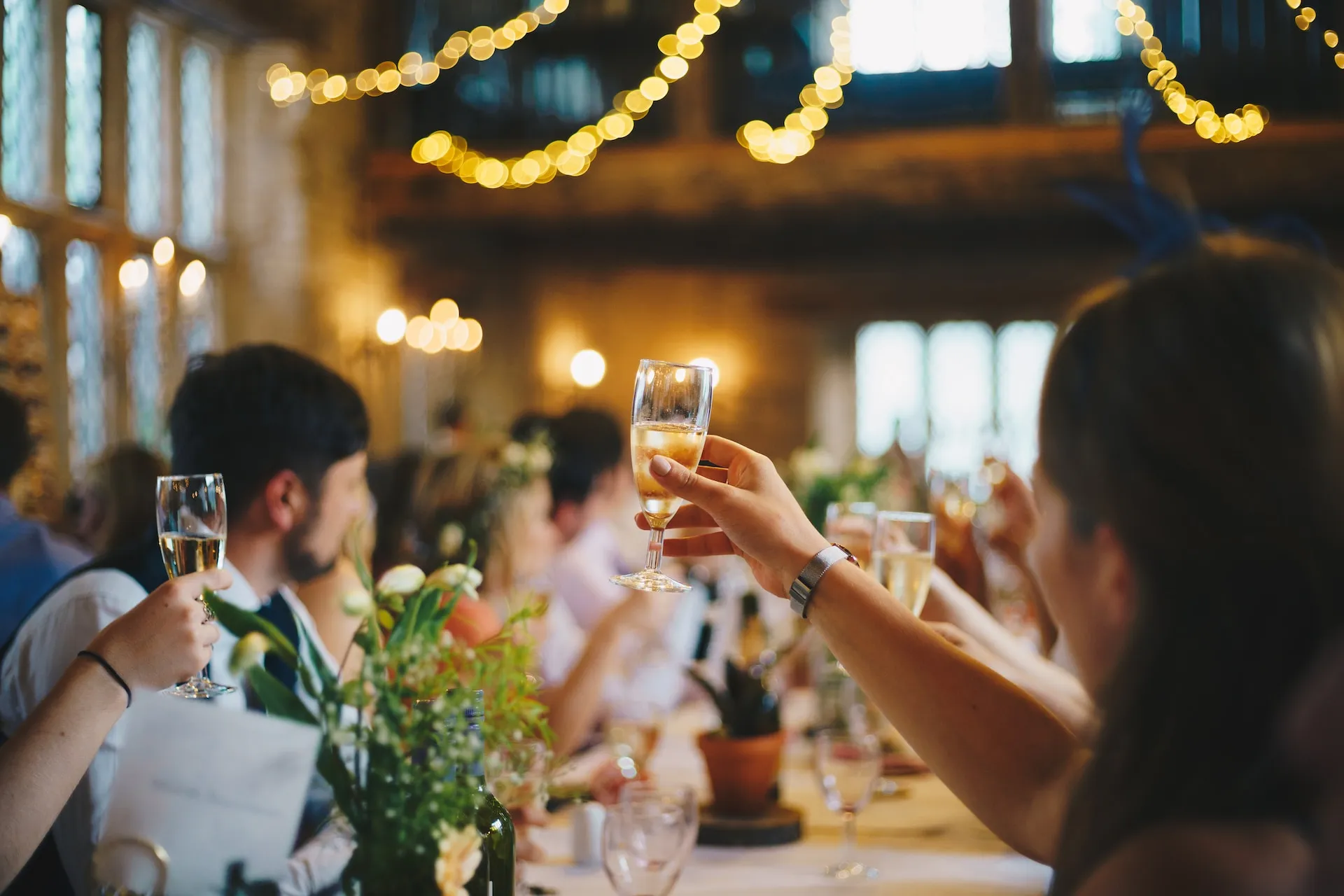 People toasting glasses at an event