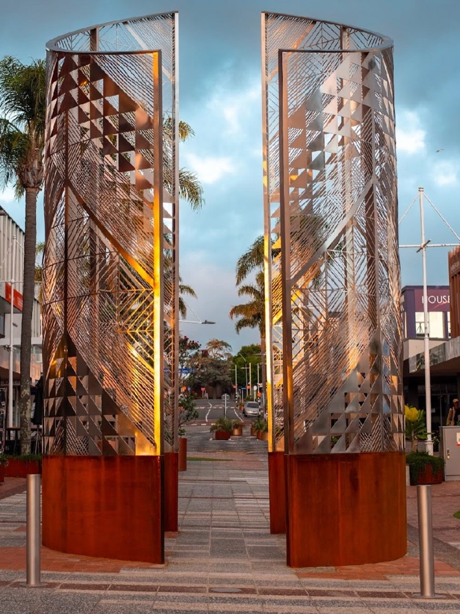 Rauhea (2024), Red Square, Tauranga Moana. Laser-cut stainless steel & Corten Steel 6.9mtrs x 4mtrs circumference