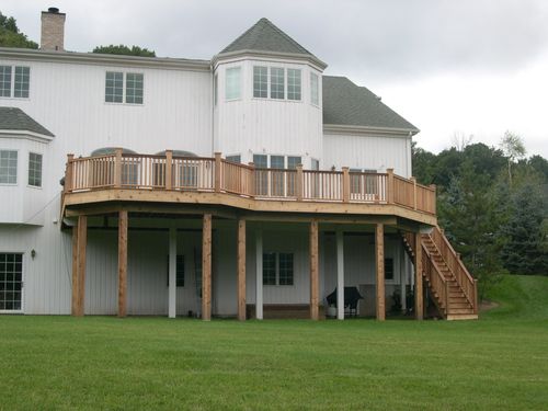 Tall lifted deck rear of house