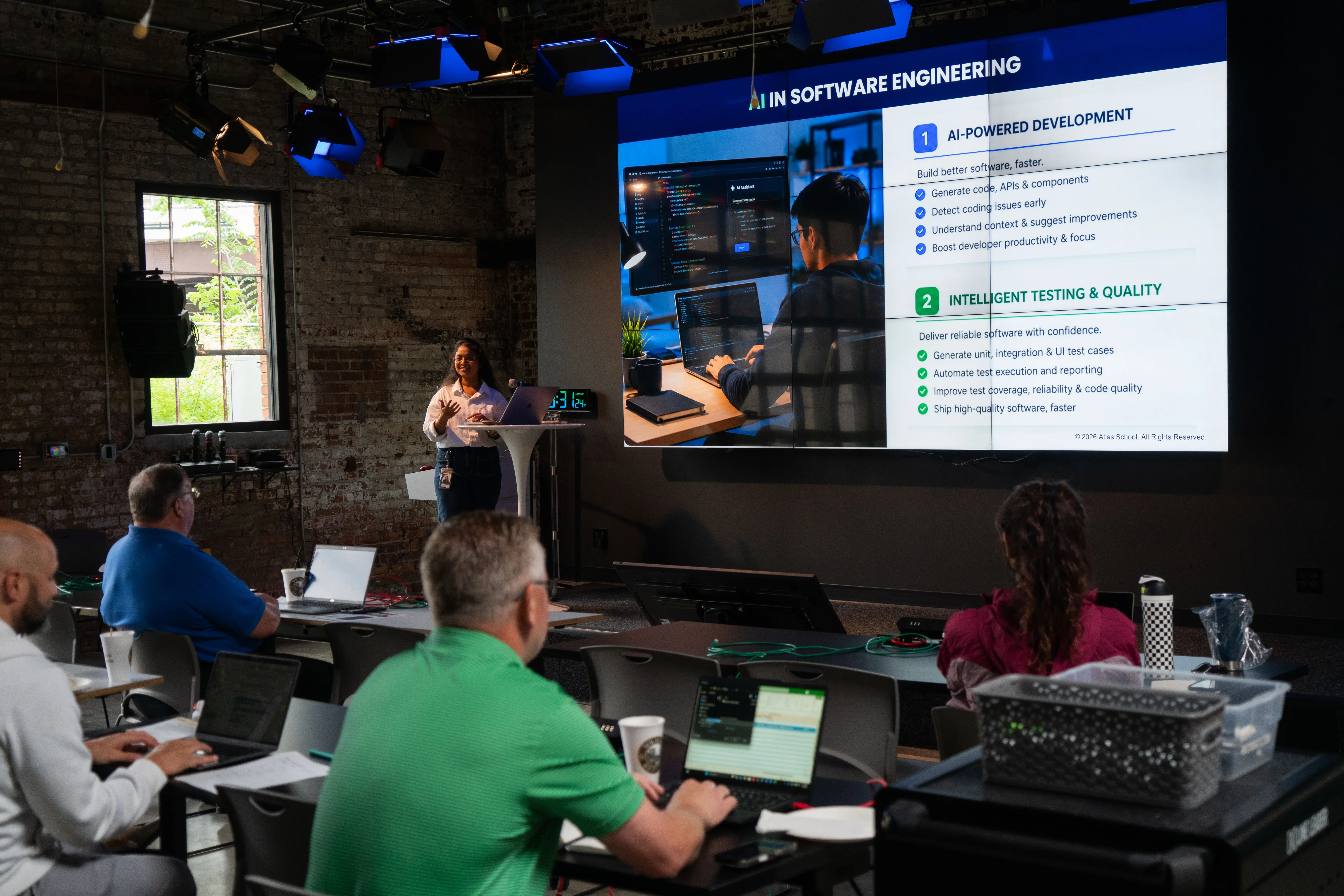 an atlas instructor teaches an AI training course on stage