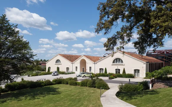 Hotel frontage with luxury car Hotel Chais Monnet & Spa Cognac