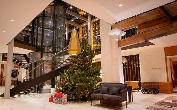 Large table with cognac bottle display Hotel Chais Monnet & Spa Cognac