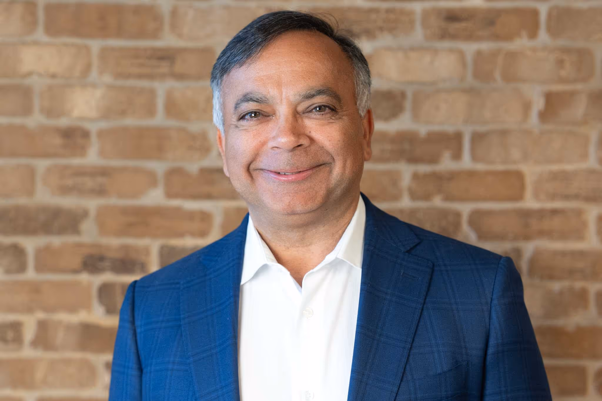 Anil Tahiliani smiling at the camera