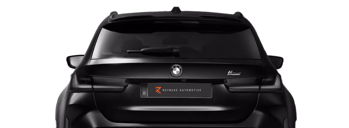 Rear view of a black BMW SUV with tinted windows and a Reyneke Automotive license plate on a black background.