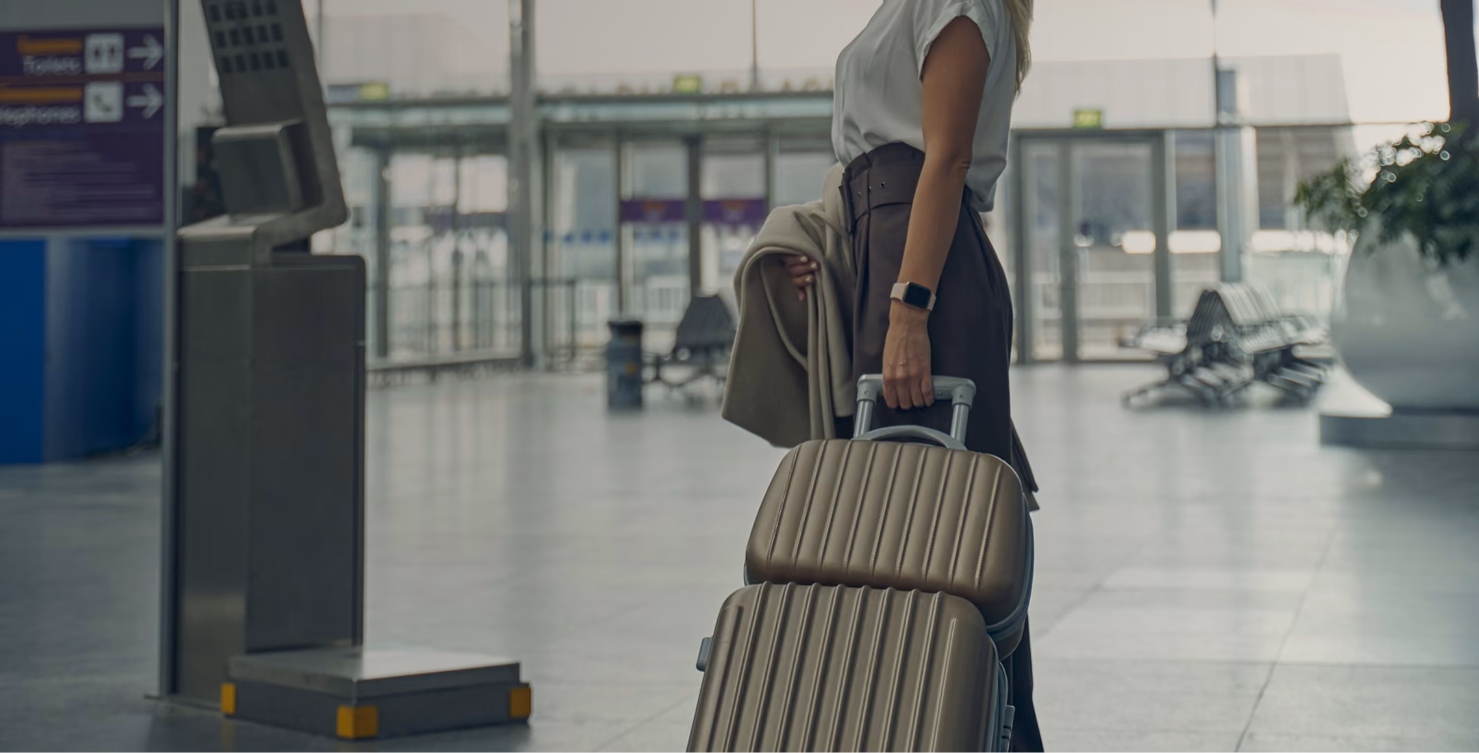 woman at airport with luggage