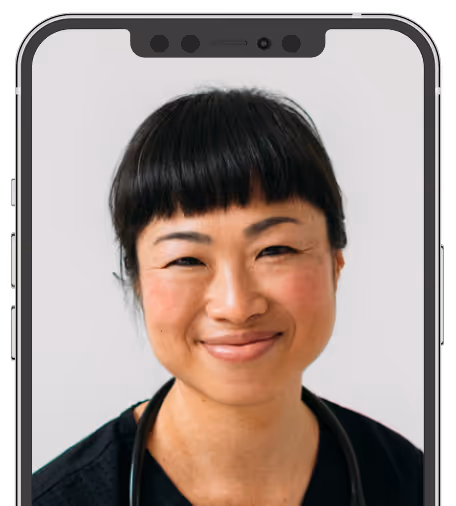 Smiling female healthcare professional with short black hair visible on a smartphone screen.