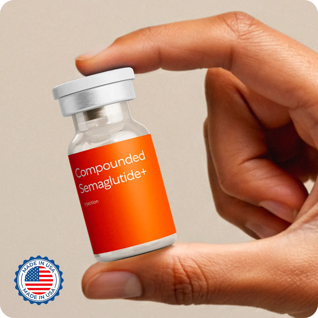 Hand holding a small vial labeled 'Compounded Semaglutide+ Injection' with a Made in USA badge in the corner.