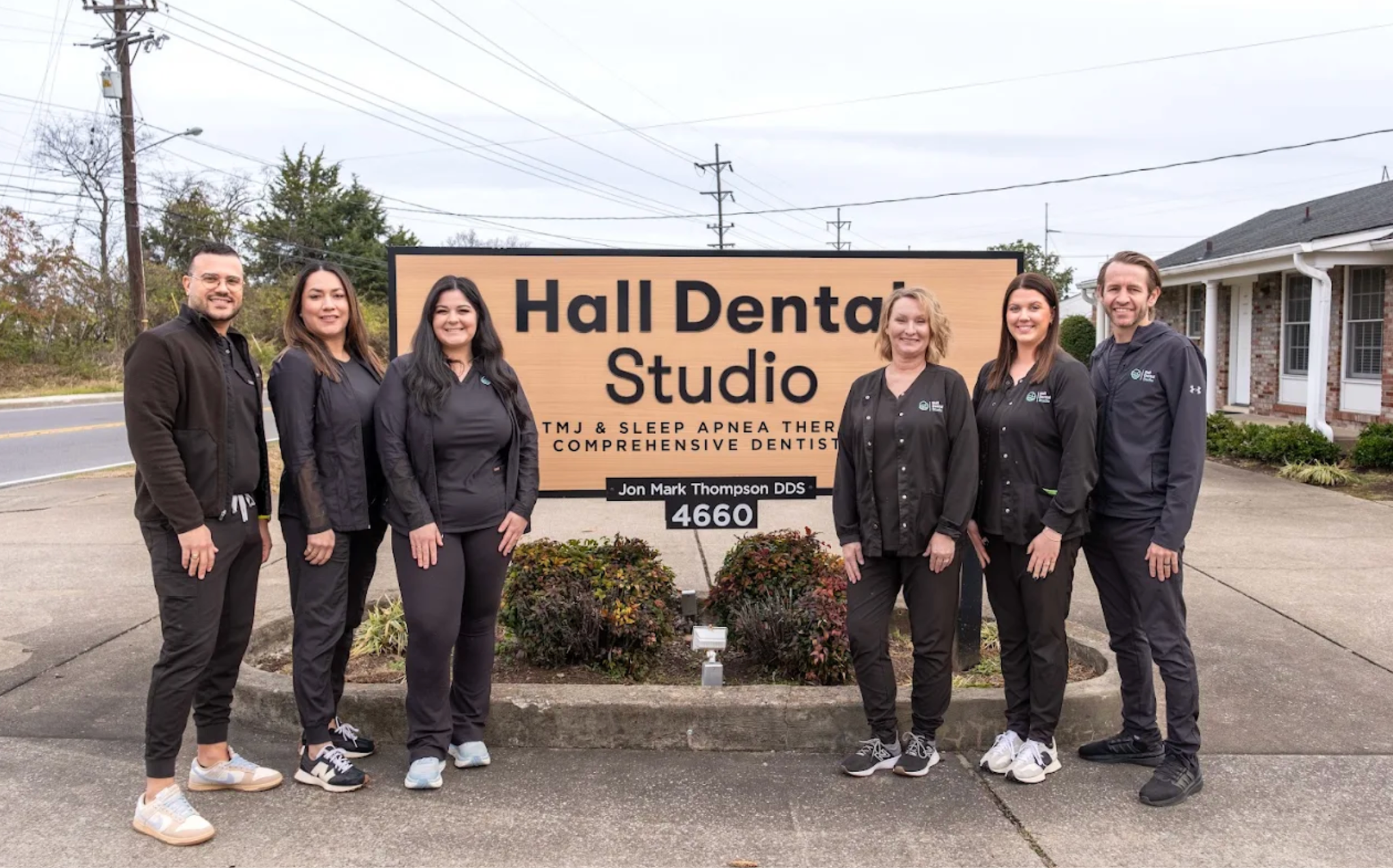 Friendly staff of Hall Dental Studio Standing in front of Hall Dental Studio Signboard at Brentwood, Nashville