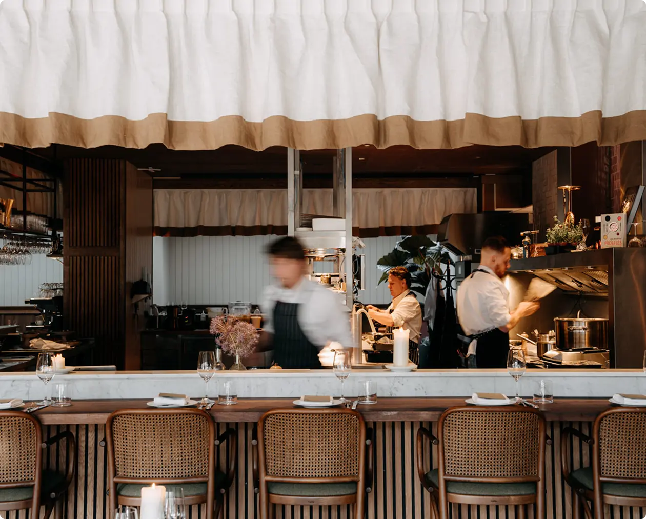 A vibrant restaurant interior showcasing diners at the counter.