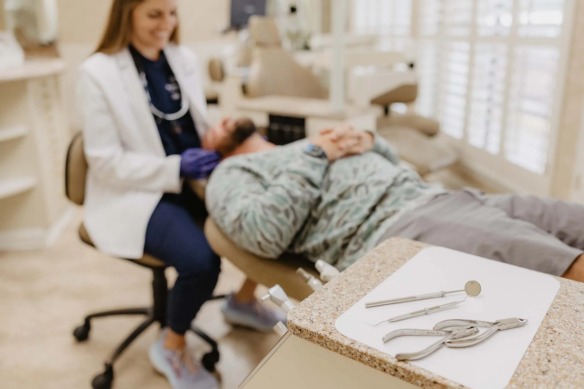 Blanchard Orthodontics | A male patient laying on a chair in Dr. Alli's office.