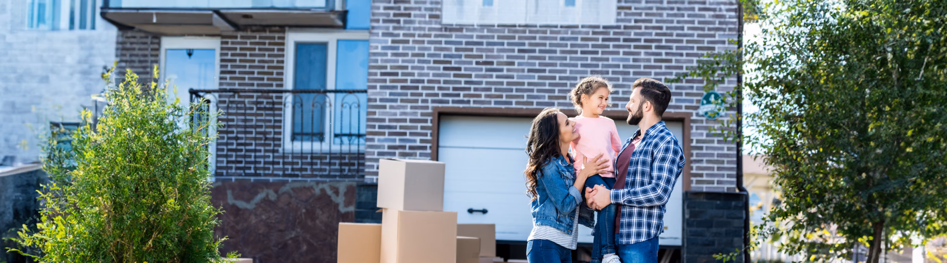 Family standing in front of their house with an American Disposal truck