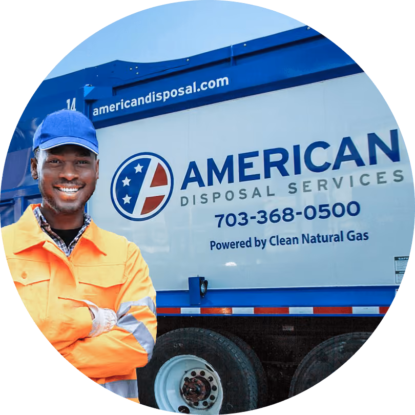 Smiling American Disposal collection worker standing in front of a company truck