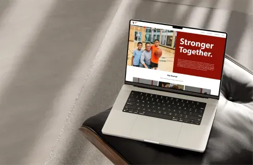 Laptop open to YMCABC unification website.