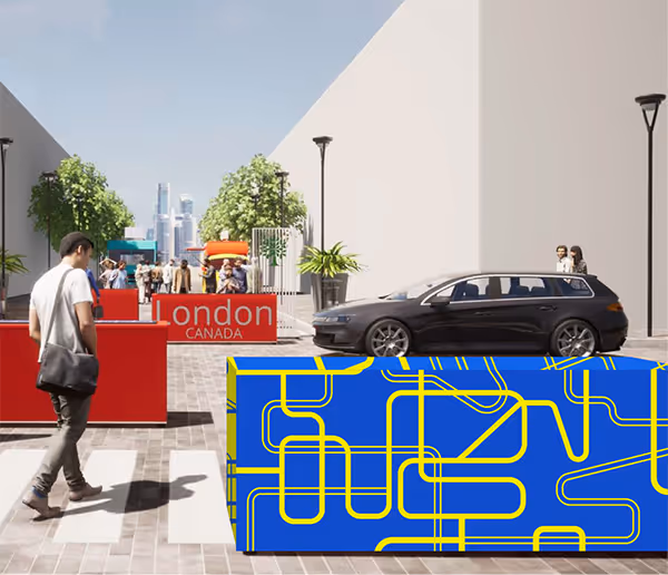 A rectangular barrier located in Downtown London, printed with blue and yellow pattern.