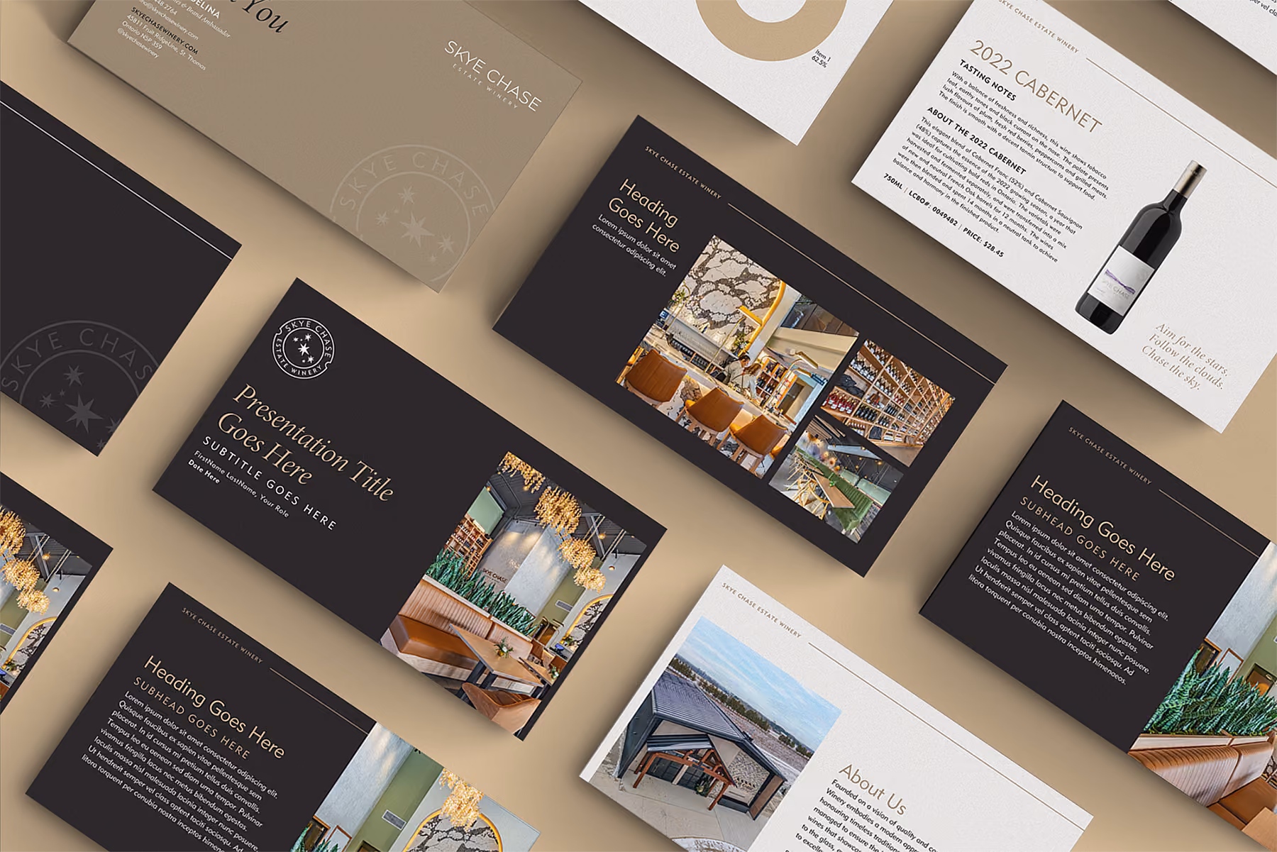 Flat lay of printed marketing materials and presentation slides featuring text placeholders, photos of a modern restaurant interior with chandeliers, exterior building shots, and a wine bottle with a 2022 Cabernet tasting note, arranged on a beige surface.