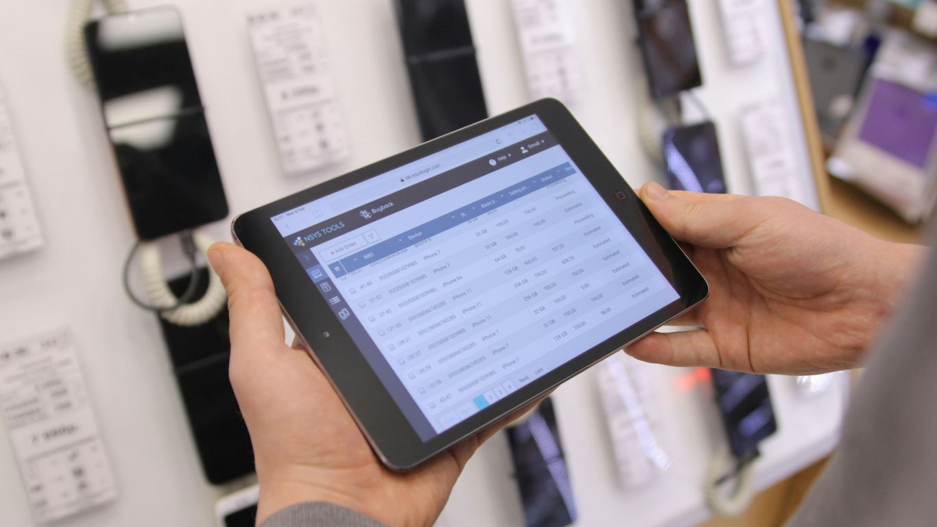 a person holding a tablet in their hand