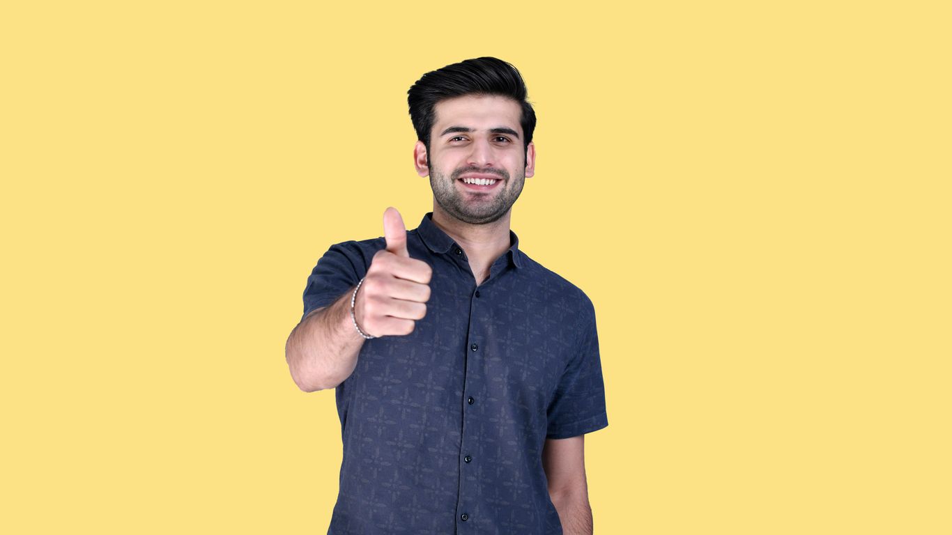 a man giving a thumbs up