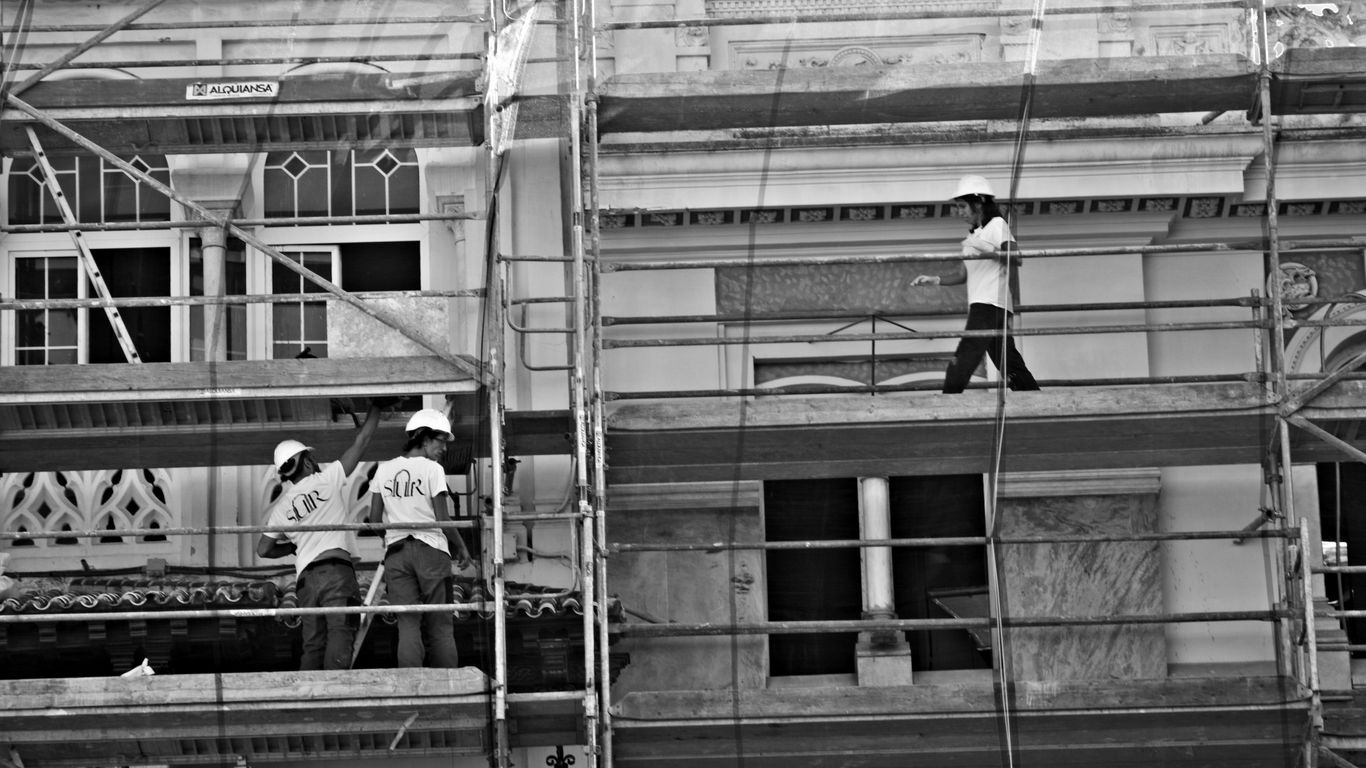 a group of men on a building