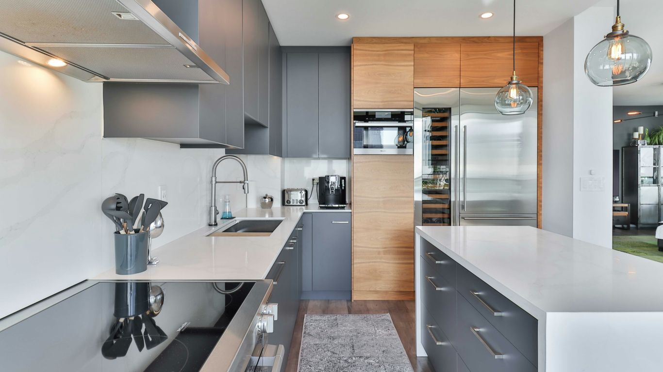 a kitchen with a bar and island