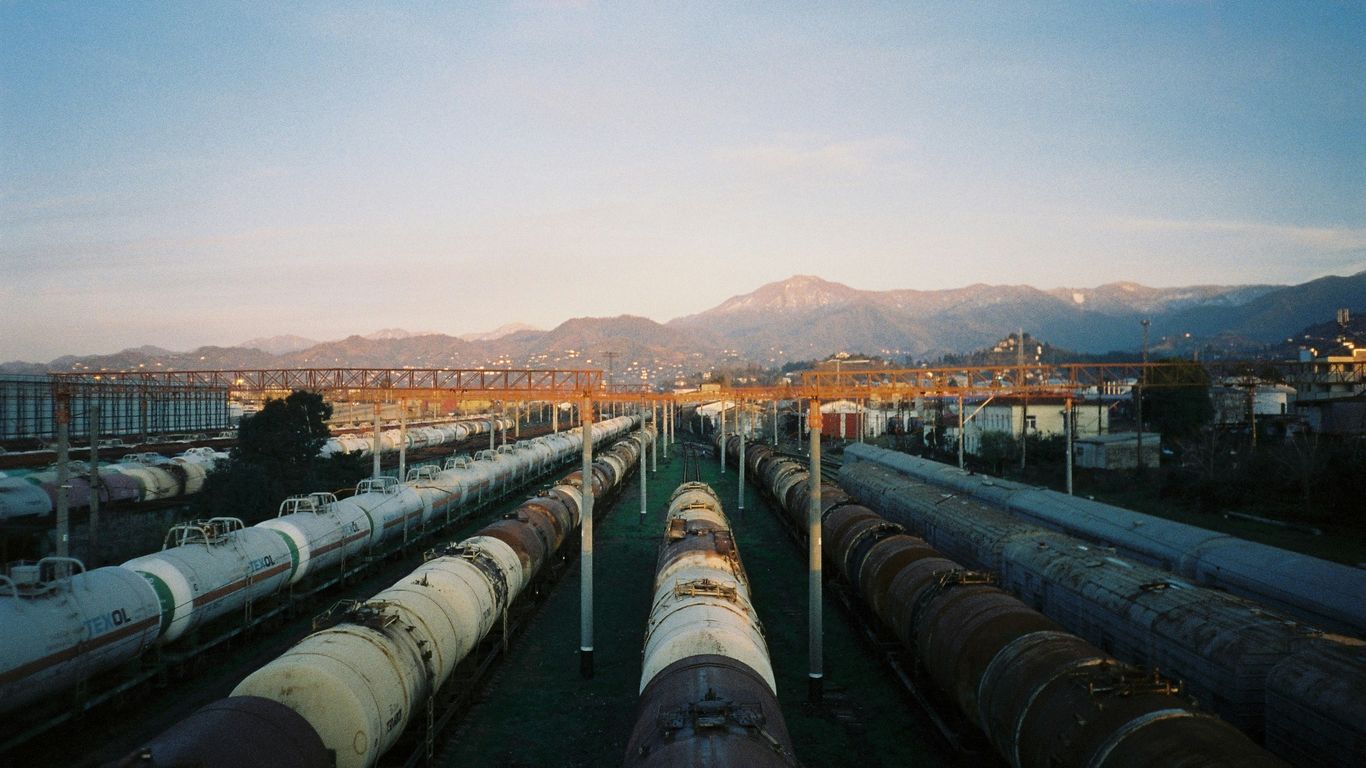a train yard filled with lots of train cars