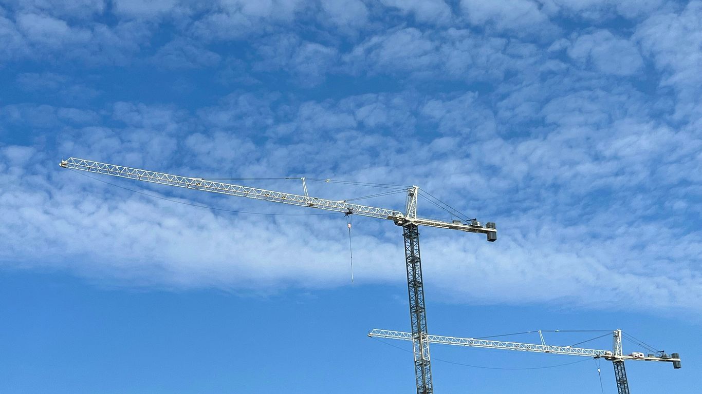 a group of metal towers with smoke coming out of them