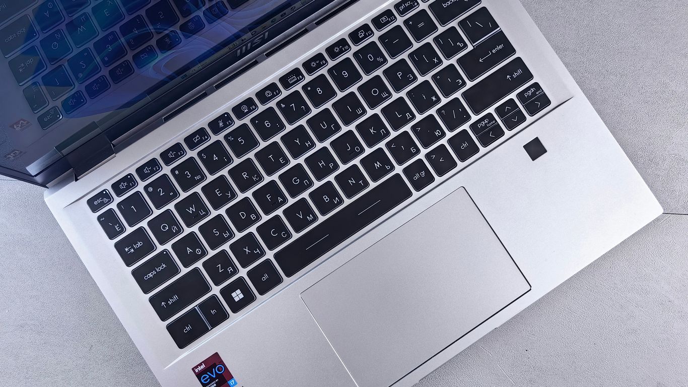an open laptop computer sitting on top of a table