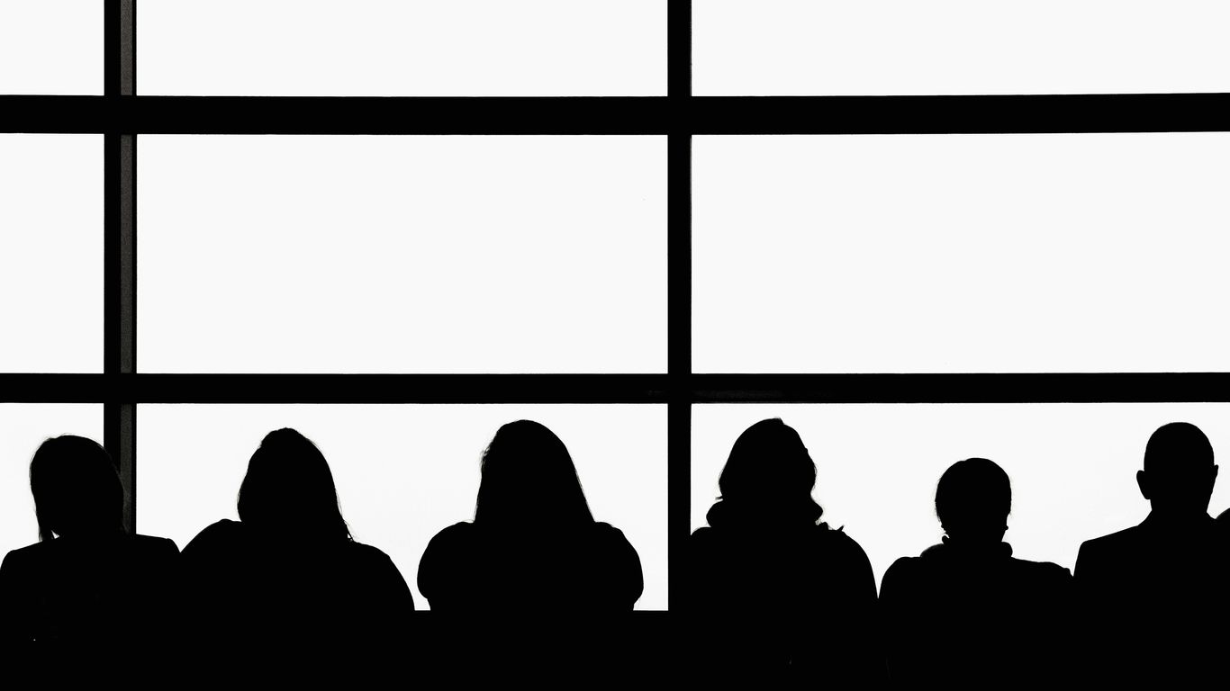 silhouette of people sitting on chair