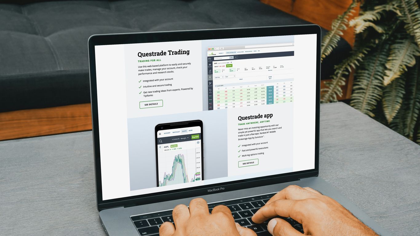 a man using a laptop computer on a table