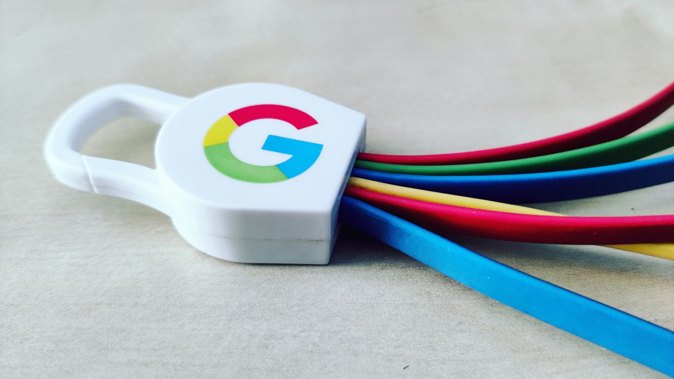 a white and blue cup with a logo on it