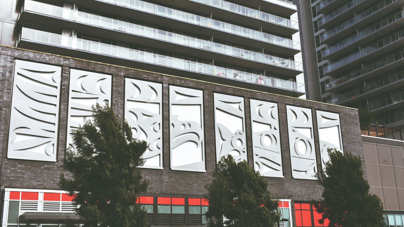 Modern building facade with abstract art panels