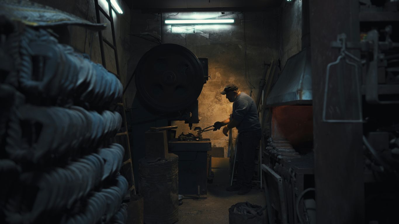 A man is working in a dark room