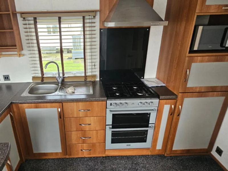 A kitchen in a tiny home with gas cooker