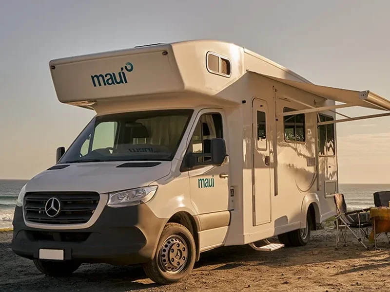 A campervan parked on coastline of papamoa