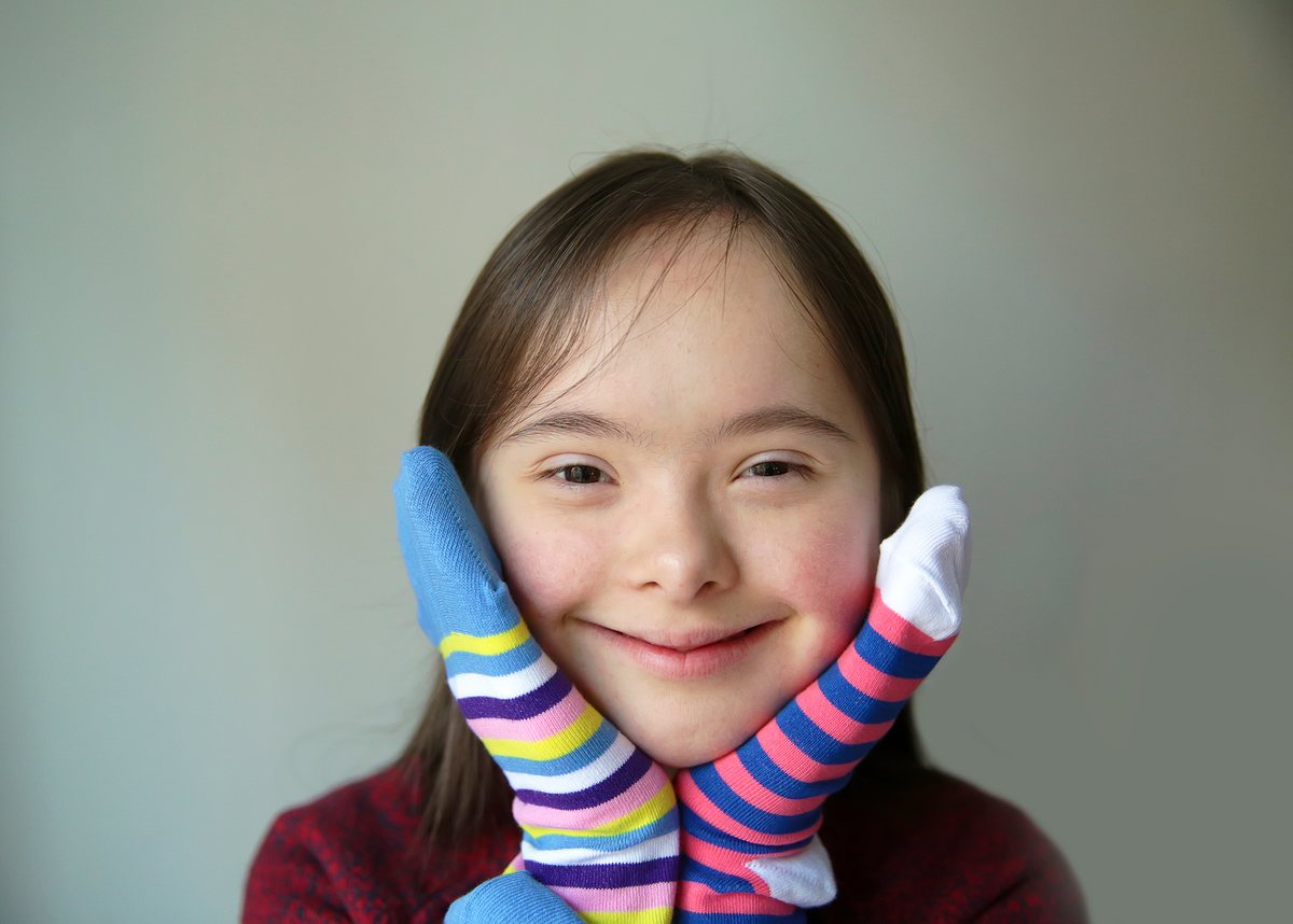 A school-age child working with an ABA therapist at home