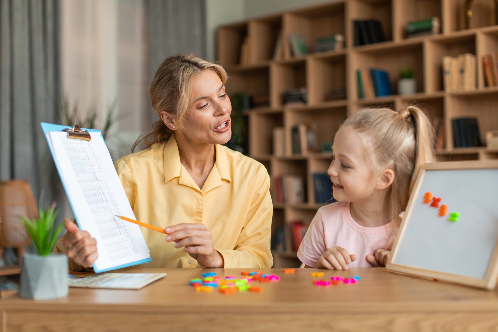 An Astra therapist working one-on-one with a child during an in-home ABA session