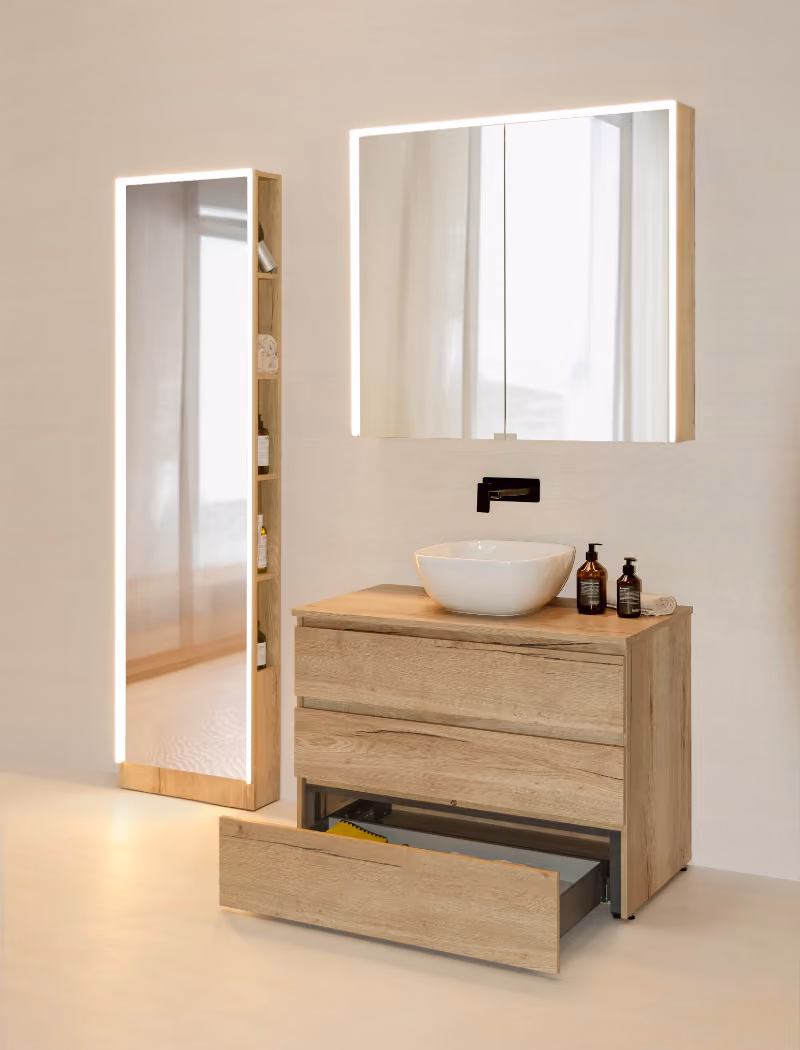 Modern bathroom vanity set with wooden drawers, vessel sink, mirror cabinet, and tall illuminated mirror shelf.