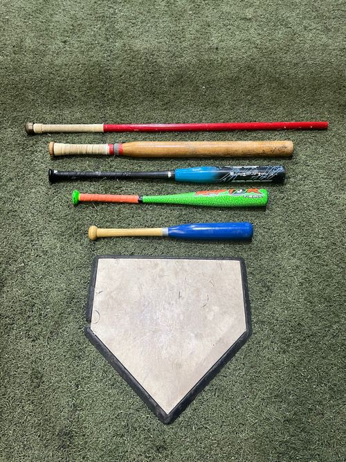 Various bats and home plate