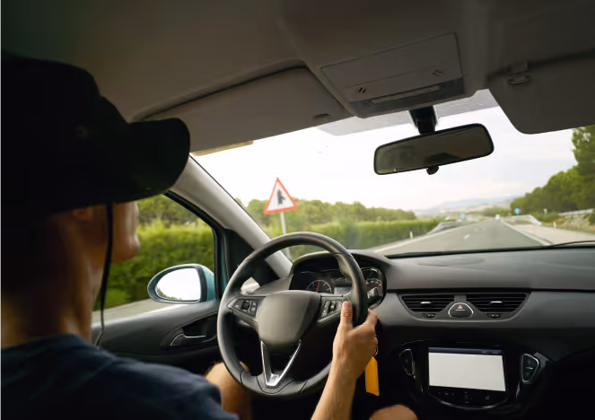 Man driving in highway Japan following Rental Car Station Itinerary