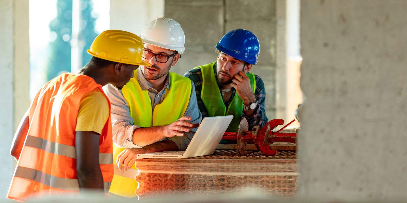 Construction workers using technology