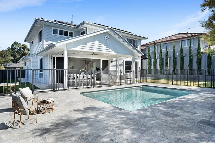 Modern family home with backyard pool, representing family-friendly suburbs in Greater Springfield.