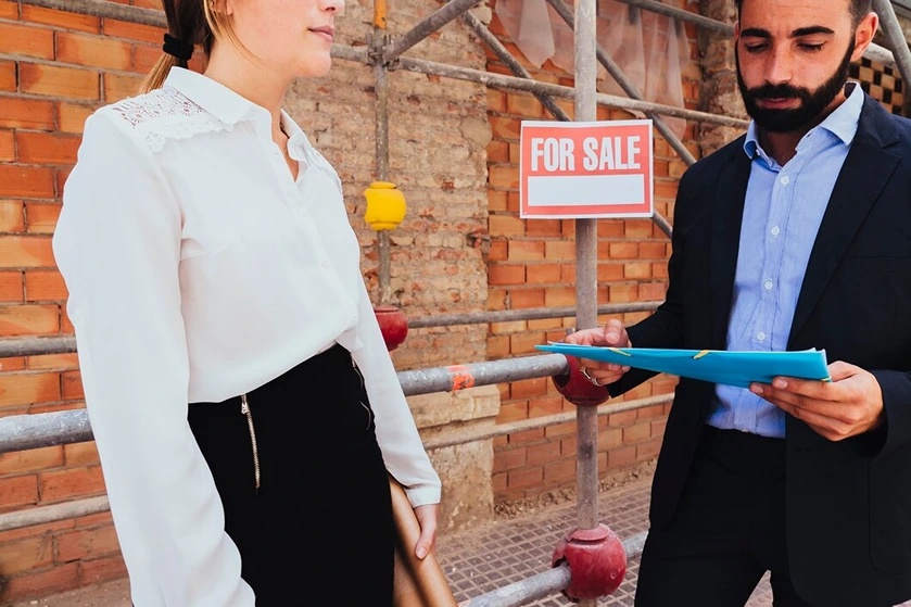 Young professionals discussing renting vs buying in the Centenary Suburbs with Clare May Real Estate