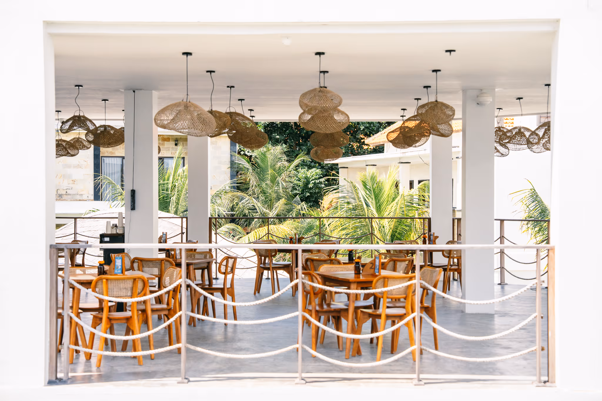 Open-air dining area at Kala Surf Camp in Uluwatu, Bali